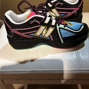 New Balance Black and Blue Sneakers with Pink and Yellow Accents